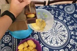 potato grinder making dumplings